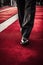 A luxury man feet is walking on Red Carpet in a luxury event for confidence businessman concept.