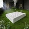 A luxury mattress in a beautiful black room with green grass and a crystal chandelier. 3d render