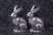 Luxury metal easter bunnies in silver on dark background