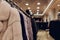 Luxury mink coats. Grey, brown, pearl color fur coats on showcase of market. Best gift for women is mink coat. Outerwear