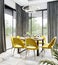 Luxury modern dinning room interior background for mockup with bright yellow chairs, table with dishes, panoramic windows and gold