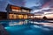 Luxury modern house with swimming pool at sunset. Nobody inside