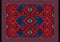 Luxury oriental carpet in red, blue shades with maroon and gray patterns on black background