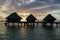Luxury overwater villas during sunrise and Otemanu mountain at Bora Bora island, Tahiti