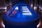 A luxury pillared spa hall with the illuminated plunge pool in the centre. An empty beautiful blue-tiled spa pool of the deluxe ho