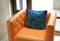 Luxury pillows on the orange leather sofa