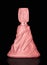 Luxury pink perfume bottle in the silk on black background