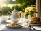 Luxury porcelain crockery set for traditional English tea and breakfast, served outdoors with the sunny morning