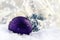 Luxury purple Christmas ball with ornaments in Christmas Snowy Landscape.