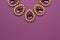 Luxury purple jewelry in the Baroque style on a purple background. Vintage, retro style.