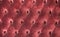 Luxury red velvet cushion close-up background
