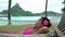 Luxury resort beach holiday woman relaxing lying down in hammock in Bora Bora