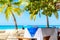 Luxury resort. Empty table for dinner near palm trees on the caribbean tropical beach. Saona Island, Dominican Republic. Vacation