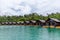 Luxury Resort with Floating Raft Houses on Green Lake with Tropical Trees