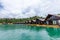 Luxury Resort with Floating Raft Houses on Green Lake with Tropical Trees