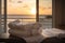 luxury resort, with view of the ocean and sunset, featuring stack of freshly washed towels and linens