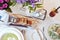 Luxury restaurant table with Chicken Caesar Salad and cream soup