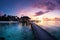 Luxury retreat Maldives sunset, tranquil scenery, and beach landscape panorama