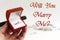 Luxury ring in hand, will you marry me text, greeting card conce