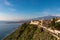 Luxury San Domenico Palace Hotel with panoramic view on snow capped Mount Etna volcano and Mediterranean sea in Taormina, Sicily