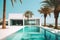 Luxury seaside house on sea shore among palm trees. Exterior of amazing modern minimalist cubic villa with large swimming pool.