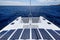 Luxury solar powered catamaran, fully sustainable and powered by solar energy, charging batteries aboard a sailboat, vessel in