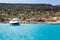 Luxury speedboat waving in blue lagoon of Mediterranean sea. Cyprus island with beautiful coastline, copyspace