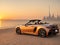 Luxury sport car convertible in Dubai at sunset