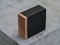 Luxury Square Golden Box Mockup in Black textured cover on concrete table