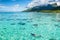 Luxury travel vacation tourist woman snorkeling in Tahiti ocean, Moorea island, French Polynesia. Snorkel swim girl