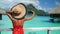 Luxury travel vacation. Tourist woman using phone to take photo at view of ocean and mountain landscape on Bora Bora