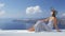 Luxury travel vacation woman looking at Santorini