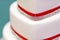Luxury wedding cake with crystals and red ribbon