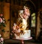 Luxury wedding cake, exclusive high-end design, beautifully decorated professional multi tier premium cake as main