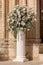 Luxury wedding floral decorations at the entrance of Ostuni church.