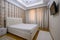 Luxury well designed modern beige master bedroom