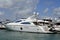 Luxury white motor yacht moored at a condo/marina complex in southeast Florida