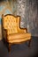 Luxury wooden chair with beige leather. Antique armchair isolated on concrete background.elegant design.classic royal luxury style