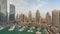 Luxury yacht bay in the city aerial timelapse in Dubai marina