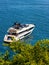 Luxury yacht entering marina offshore Azure Cost of Mediterranean Sea in Villefranche-sur-Mer resort town in France