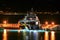Luxury yacht moored on pier night