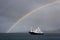 Luxury yacht and rainbow in the South Pacific