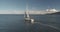 Luxury yacht sail at ocean bay aerial. Passenger sailboat race at sea Arran Island, Scotland, Europe