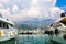 Luxury yachts and sailing ships moored at wharf in Budva marina, Montenegro. Port in sea. White motor boats and sailboats.