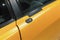 Luxury yellow roadster fragment, door lock