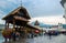 Luzern, Switzerland - September 15, 2016: Wooden Chapel Bridge with blooming flowers on Reuss river and Water Tower