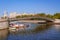 Luzhkov bridge in Moscow and river boats underneath