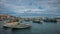 Luzzu, typical fishing boats of Malta moored in the marina of Ma