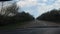 LVIV, UKRAINE - APRIL 14, 2019: The driver on the car goes on the highway and overtakes the truck. The road is very bad