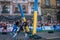 LVIV, UKRAINE - AUGUST 2017: A strong bodybuilder athlete lifts a huge steel heavy pipe to the strongman game in front of enthusia